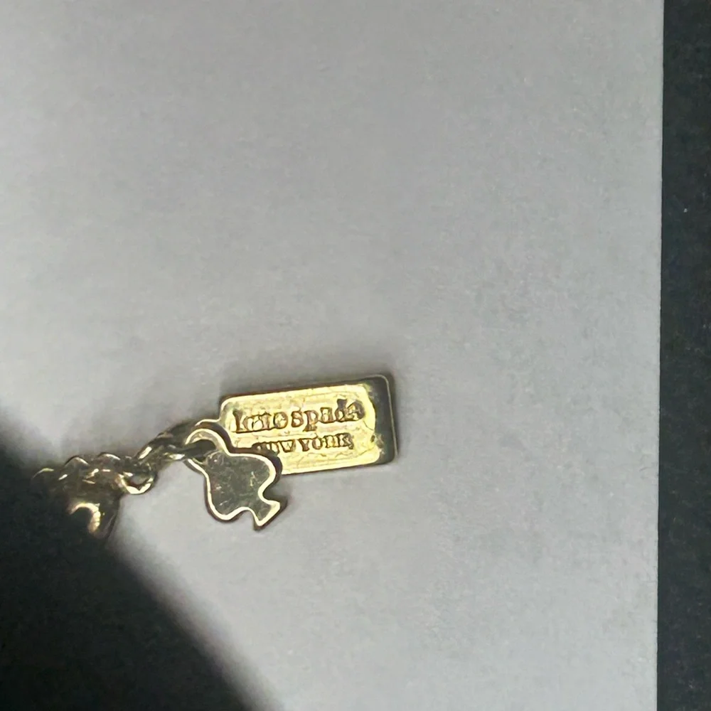 Kate Spade Gold-Tone Charm Necklace – Iconic Spade Cutout & Gem Accent